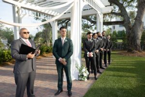A groom standing at the altar at the Wedding Garden at Ocoee Lakeshore Center.