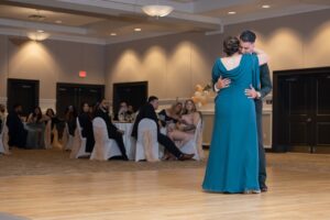 A groom and his mother share a dance on the dance floor in the ballroom at Ocoee Lakeshore Center.