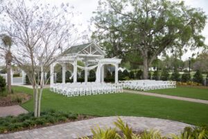 The wedding garden at Ocoee Lakeshore Center with white chairs set for a wedding ceremony.