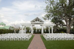 The wedding garden at Ocoee Lakeshore Center with white chairs set for a wedding ceremony.